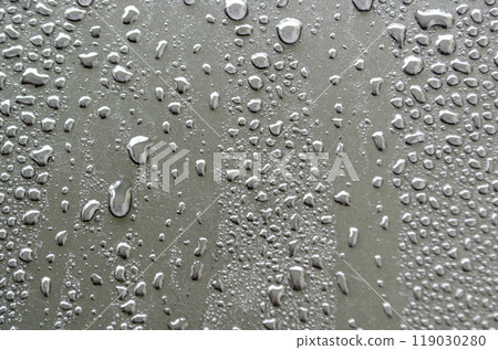 Close up of water droplets on dark cover background. Water or rain droplets and wallpaper design concept Close up of water droplets on dark cover background. Water or rain droplets and wallpaper design concept 119030280