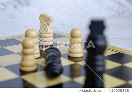 The knight gambit leads to a tactical quest for victory. End game concept 119030288