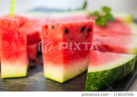 pieces of ripe red watermelon, close-up, on a board pieces of ripe red watermelon, close-up, on a board 119030566