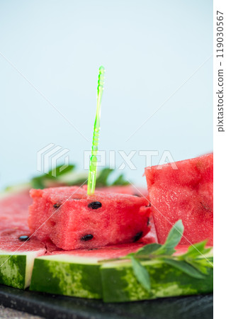 pieces of ripe red watermelon, close-up, on a board 119030567