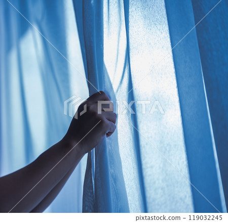 A woman by the window 119032245