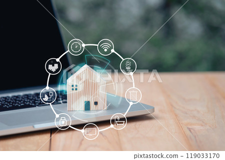 House wooden model and icons on computer laptop with copy space. Loan real estate or property mortgage investment concept. natural environment house. 119033170