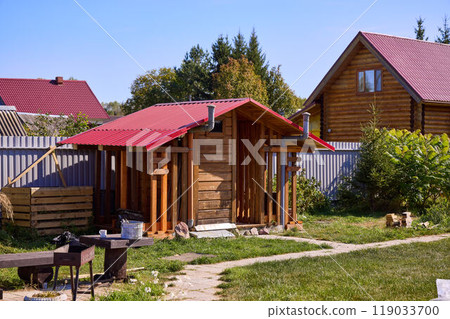 Rustic Outdoor Wooden Toilet in Countryside Setting Rustic Outdoor Wooden Toilet in Countryside Setting 119033700