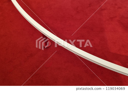 Minimalist Red Carpet with Curved White Barrier for Modern Interior Design Minimalist Red Carpet with Curved White Barrier for Modern Interior Design 119034069