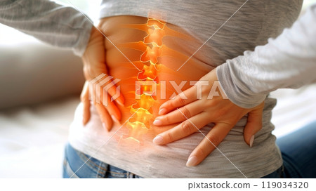Close-up of young woman experiencing severe lower back pain, spinal pain relief concept. Close-up of young woman experiencing severe lower back pain, spinal pain relief concept. 119034320