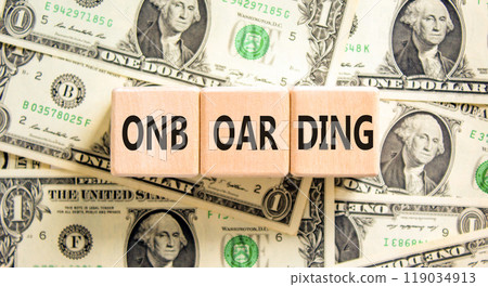 Onboarding success symbol. Concept word Onboarding on wooden blocks. Dollar bills. Beautiful background from dollar bills. Business onboarding success concept. Copy space. 119034913