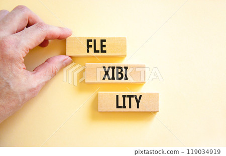 Flexibility symbol. Concept word Flexibility on beautiful wooden blocks. Businessman hand. Beautiful white background. Business flexibility concept. Copy space. Flexibility symbol. Concept word Flexibility on beautiful wooden blocks. Businessman hand. Beautiful white background. Business flexibility concept. Copy space. 119034919