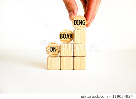 Onboarding success symbol. Concept word Onboarding on wooden circles. Businessman hand. Beautiful white background. Business onboarding success concept. Copy space. 119034924