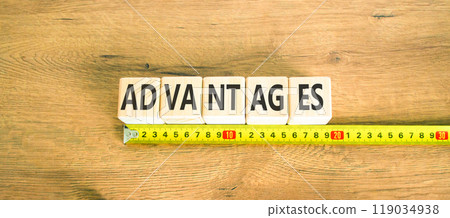 Advantages symbol. Concept word Advantages on beautiful wooden cubes. Beautiful wooden background. Beautiful yellow ruler. Business advantages concept. Copy space. 119034938
