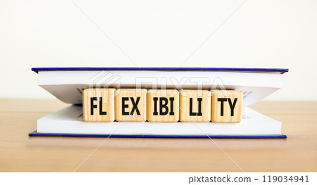Flexibility symbol. Concept word Flexibility on beautiful wooden cubes in book. Beautiful wooden table white background. Business flexibility concept. Copy space. Flexibility symbol. Concept word Flexibility on beautiful wooden cubes in book. Beautiful wooden table white background. Business flexibility concept. Copy space. 119034941