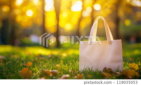 Eco bag mockup on green grass in a park 119035053
