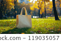 Eco bag mockup on green grass in a park 119035057