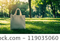 Eco bag mockup on green grass in a park 119035060