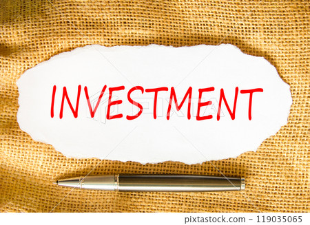 Investment symbol. Concept word Investment on beautiful white paper. Beautiful canvas background. Beautiful black pen. Business investment concept. Copy space. Investment symbol. Concept word Investment on beautiful white paper. Beautiful canvas background. Beautiful black pen. Business investment concept. Copy space. 119035065