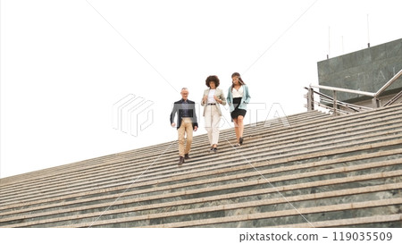 Business people discussing while descending stairs in city 119035509