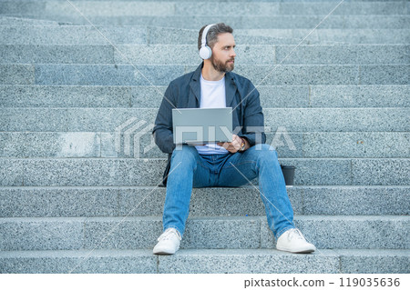 man webinar online sitting in the street. man webinar online outside. photo of man webinar online man webinar online sitting in the street. man webinar online outside. photo of man webinar online 119035636