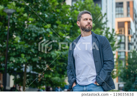 photo of caucasian guy in white shirt, copy space. caucasian guy outdoor. photo of caucasian guy in white shirt, copy space. caucasian guy outdoor. 119035638