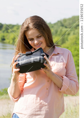 Girl with virtual reality glasses Girl with virtual reality glasses 119035652