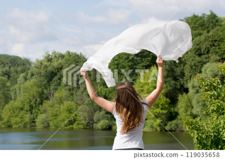Young woman with white cloth, concept of ease 119035658