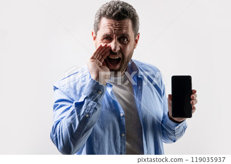 screaming man showing phone app. photo of man showing phone app. screaming man showing phone app. photo of man showing phone app. 119035937