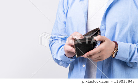 closeup of broke man with wallet isolated on studio background. broke man with wallet 119035942