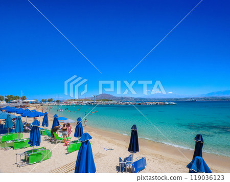 Calm white sand beach lined with parasols (Marathi Beach, Crete, Greece) 119036123