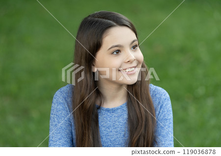 Autumn fashion girl. Trendy and stylish teenager girl smiling. Fall fashion style for teen. Complete outfit style. Girl face in casual sweater. Innocent childhood. Teen girl with long hair outdoor 119036878