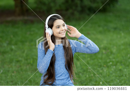 Gen z lifestyle. Style of music. Stylish teen girl listen music. School student lifestyle. Listen audio. Music lifestyle. Teen cheerful girl listen music in wireless headphones outdoor. Generation z Gen z lifestyle. Style of music. Stylish teen girl listen music. School student lifestyle. Listen audio. Music lifestyle. Teen cheerful girl listen music in wireless headphones outdoor. Generation z 119036881