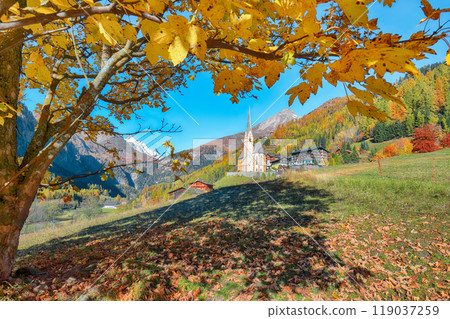 Amazing autumn landscape at Heiligenblut with St Vincent Church near Grossglockner mount . Amazing autumn landscape at Heiligenblut with St Vincent Church near Grossglockner mount . 119037259