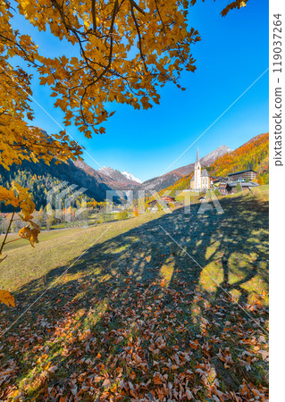Astonishing autumn landscape at Heiligenblut with St Vincent Church near Grossglockner mount . Astonishing autumn landscape at Heiligenblut with St Vincent Church near Grossglockner mount . 119037264
