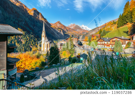 Picturesque autumn landscape  at Heiligenblut with St Vincent Church near Grossglockner mount . 119037286