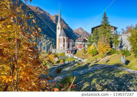 Amazing autumn landscape at Heiligenblut with St Vincent Church near Grossglockner mount . Amazing autumn landscape at Heiligenblut with St Vincent Church near Grossglockner mount . 119037287