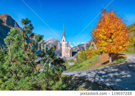 Picturesque autumn landscape  at Heiligenblut with St Vincent Church near Grossglockner mount . 119037288