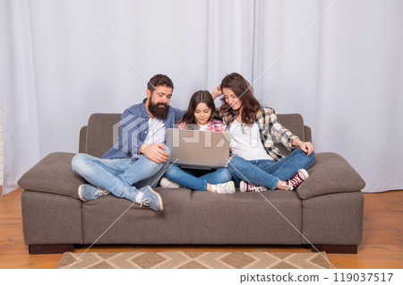 cheerful family using laptop at home, family cheerful family using laptop at home, family 119037517
