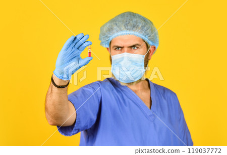 medical specialist hold test tube, selective focus. doctor wear respirator mask. nurse with coronavirus vaccine. pandemic or flu treatment. have immunity. New type pneumonia. Doctors work on symptoms 119037772