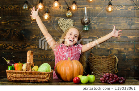 Kid girl fresh vegetables harvest rustic style. Fall harvest holiday. Child presenting harvest vegetable garden wooden background. Elementary school fall festival idea. Celebrate harvest festival 119038061