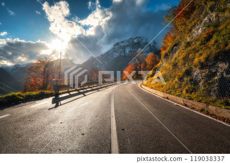 Winding mountain road at colorful sunset in golden autumn Winding mountain road at colorful sunset in golden autumn 119038337