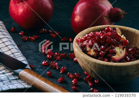 red ripe pomegranate fruits on dark background red ripe pomegranate fruits on dark background 119038370