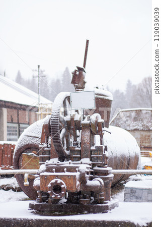 unit, an old pump for transporting oil through an oil pipeline, snow 119039039