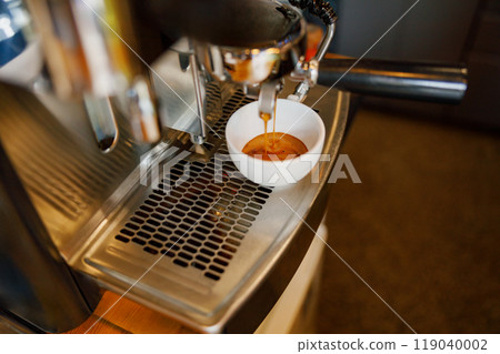 Espresso Extraction Process from Coffee Machine Situated in a Contemporary Modern Kitchen Espresso Extraction Process from Coffee Machine Situated in a Contemporary Modern Kitchen 119040002