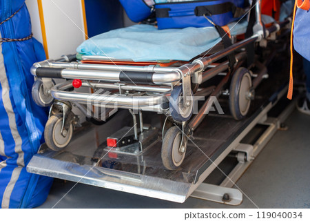 Close-up view of a folded stretcher in the interior of an ambulance Close-up view of a folded stretcher in the interior of an ambulance 119040034