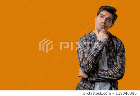 Thinking around mature man, yellow background. Smart student guy finding answer 119040386
