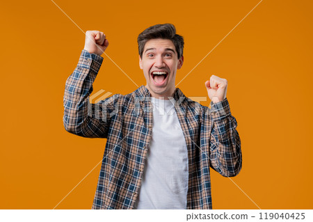 Mature man shows triumph yes gesture of victory.Surprised excited happy dude won 119040425