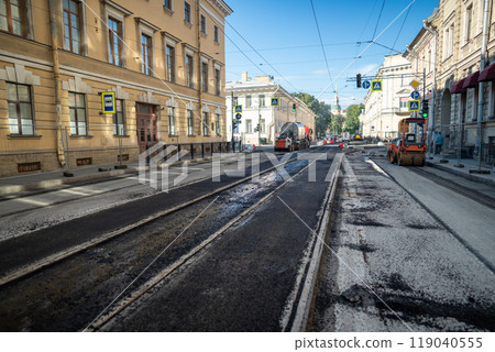 Removing asphalt for major tram track and road repair in city, urban infrastructure maintenance Removing asphalt for major tram track and road repair in city, urban infrastructure maintenance 119040555