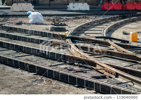 Major tram track overhaul on closed city street. Rail junction with beams, tools awaiting completion 119040900
