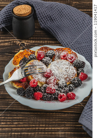 Cottage cheese pancakes with fresh raspberries, blackberries and powdered sugar Cottage cheese pancakes with fresh raspberries, blackberries and powdered sugar 119041417