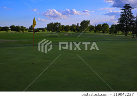 Blue sky and clouds in the evening, golf course at dusk Blue sky and clouds in the evening, golf course at dusk 119042227