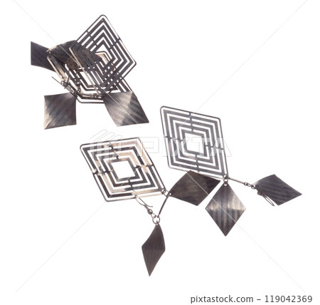 Fashion Silver Earrings with beautiful work detail is value. Luxury Silver diamond earring is fashion trend and fly in air. White background isolated 119042369