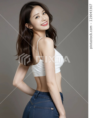 A woman wearing jeans looks back 119043307