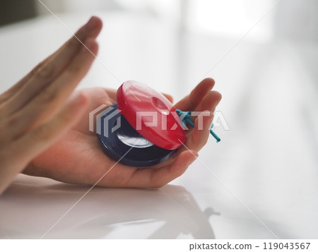 Child's hands playing castanets 119043567